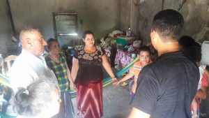 Brother Cecilio shares prayer with a family of Jobal in their home as part of his mission to the people.