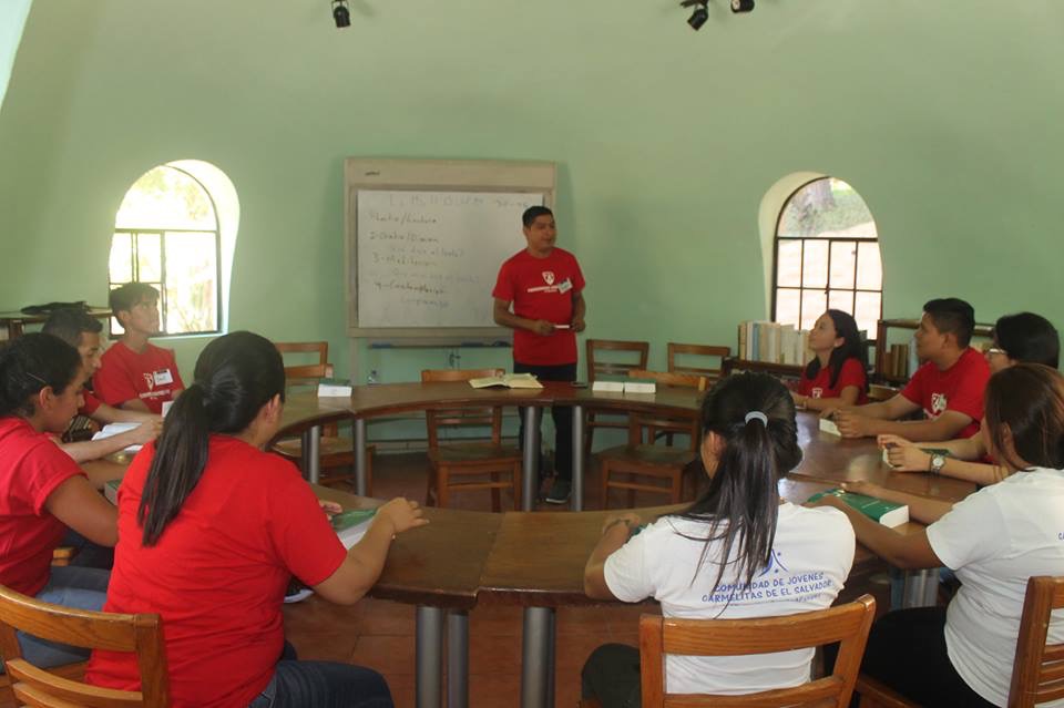 Br. Roger Melara, O. Carm., working with a group of Carmelite Youth in the library of Centro Xiberta.