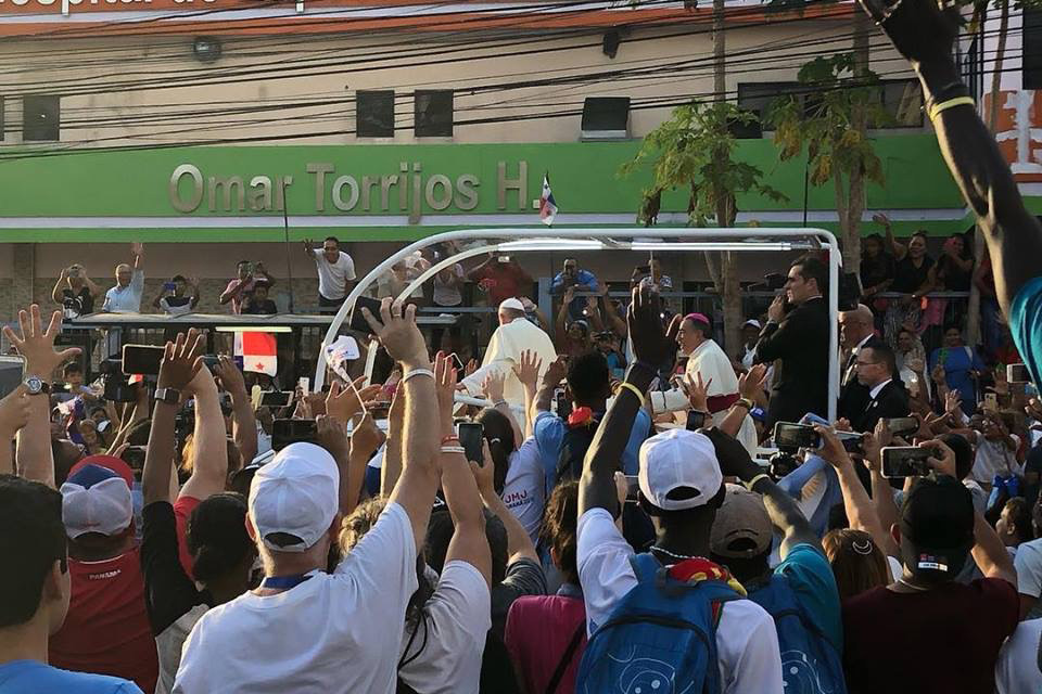 Youth from around the world, including more than 100 from the Carmelite Youth in El Salvador, greet Pope Francis at World Youth Day.